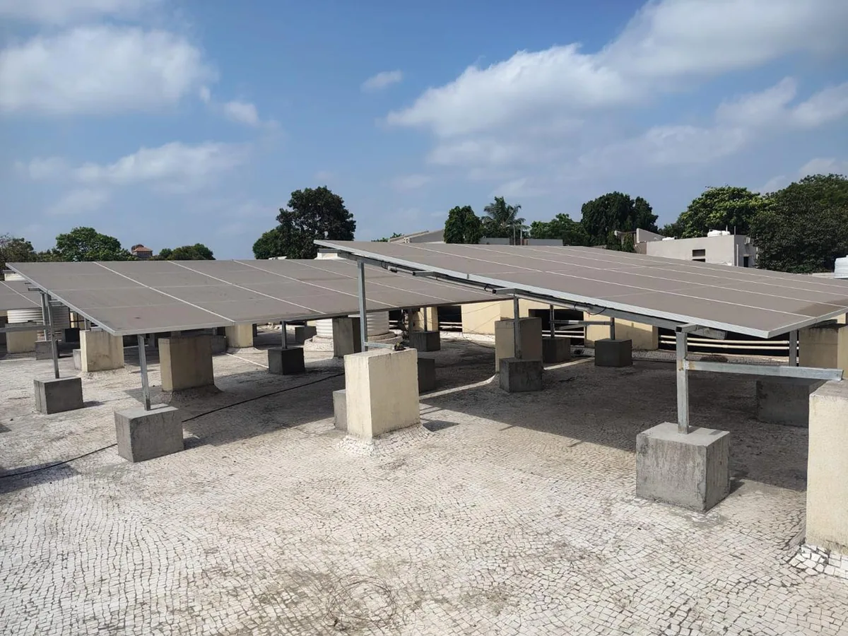 Multi-row rooftop solar installation with raised foundations and service access